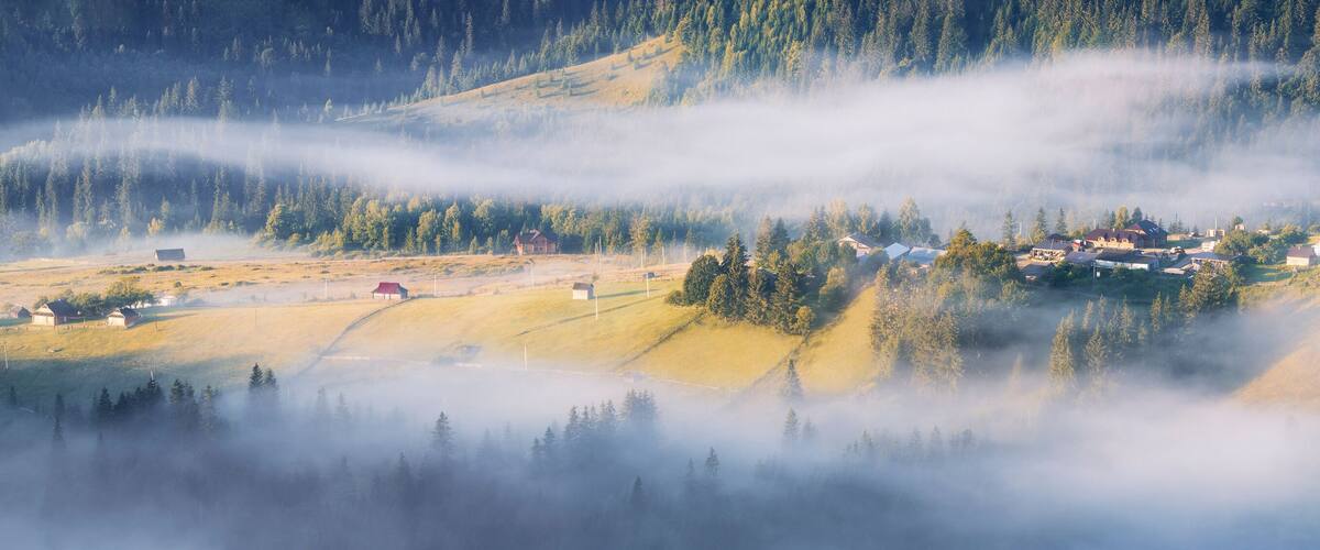Ukraine, Ivano Frankivsk region, Verkhovyna district, Dzembronya village, Panoramic view of rolling landscape in Carpathian Mountains