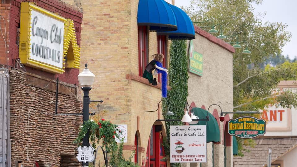 A street with a brick building, a sign for Grand Canyon Coffee & Cafe LLC, and a sign for Pancho's Mexican Restaurant.