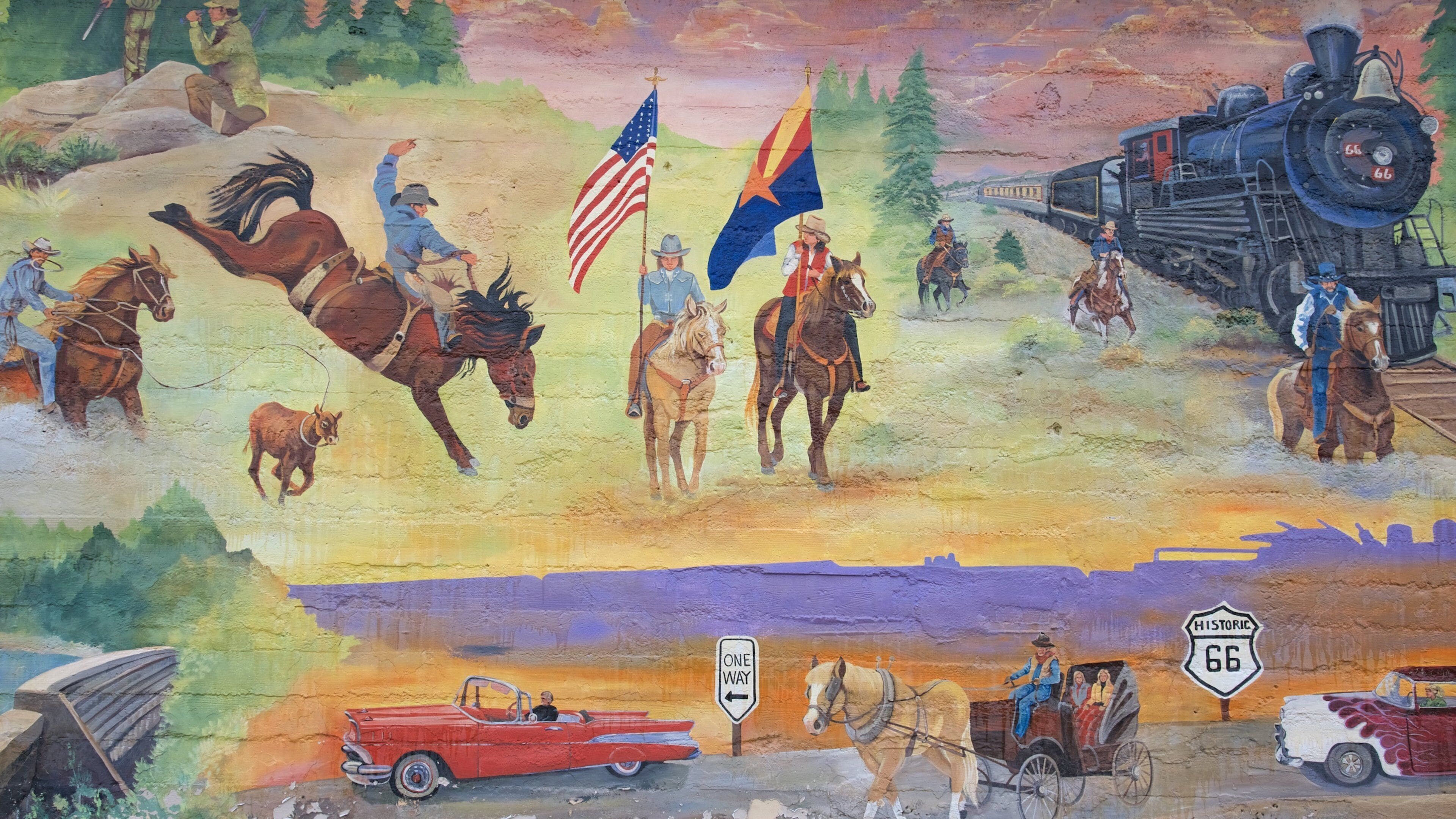 A mural with horses, riders, a train, and vintage cars.