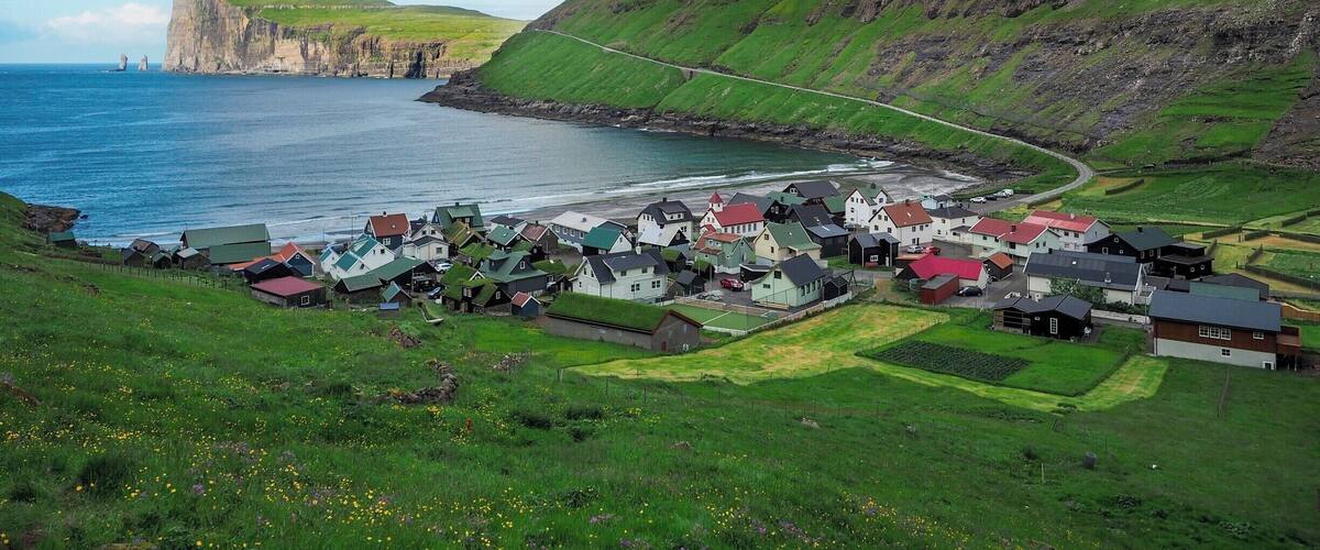 The tiny town of Tjørnuvík is the northernmost village on the island of Streymoy in the Faroe Islands. The road to get here is narrow and winding, but the views are SO worth it.