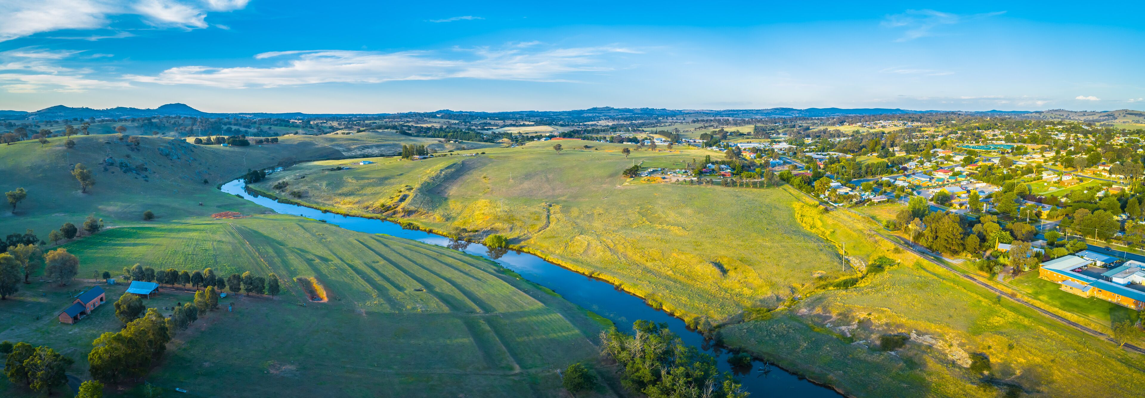 Wide aerial panoram of Yass river and surrounding countryside at sunset in New South Wales, Australia