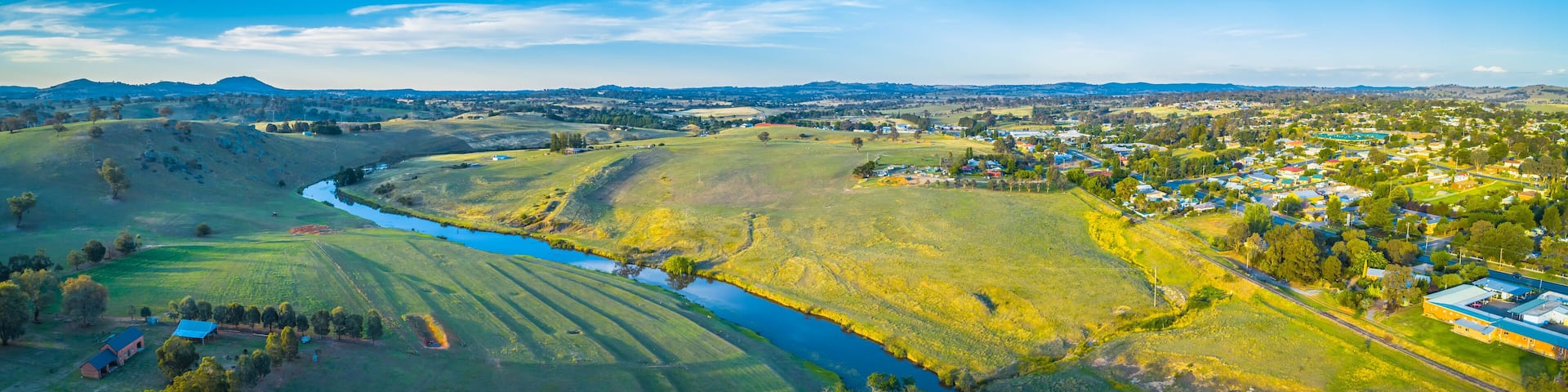 Wide aerial panoram of Yass river and surrounding countryside at sunset in New South Wales, Australia