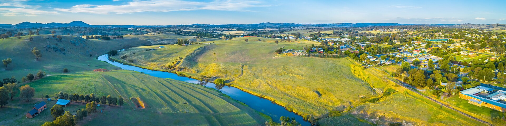 Wide aerial panoram of Yass river and surrounding countryside at sunset in New South Wales, Australia