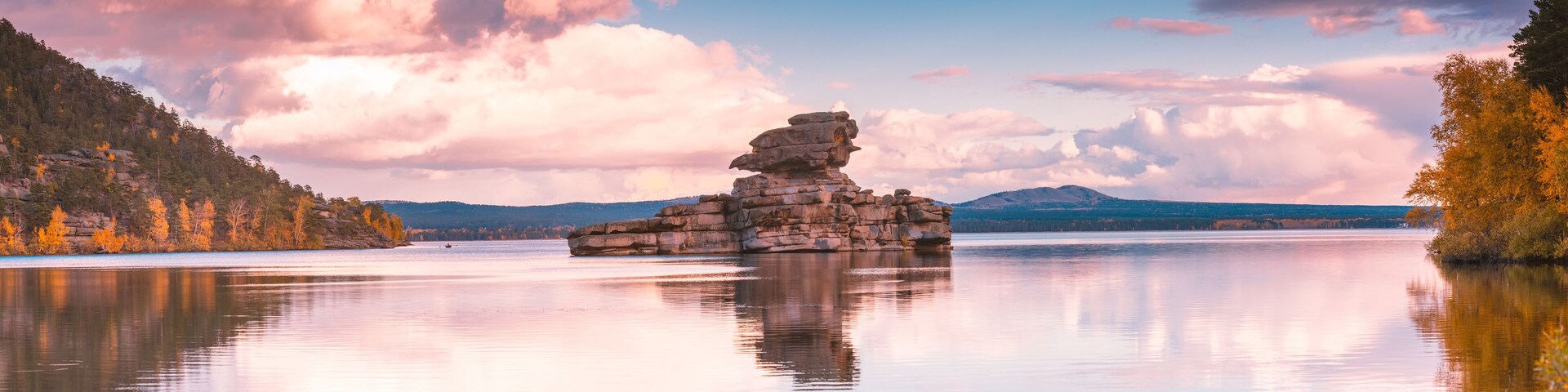 Beautiful morning landscape. Borovoe lake and stone sculprure Jumbaktas, Burabay National park in Northern Kazakhstan.