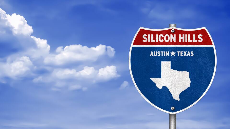 A road sign with 'Silicon Hills' and 'Austin Texas' written on it.