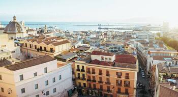 Panoramic view of the harbour of Cagliari from Viale Buoncammino during the golden hour.