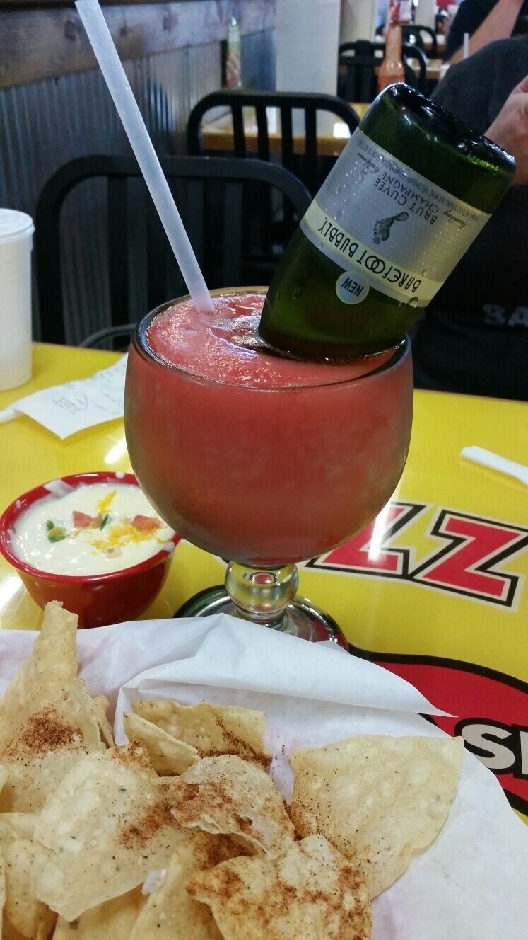 The best place - Fuzzy's Taco Shop in St. Louis.  Check out this Morning Glory drink.  It's a sublime, sweet frozen drink with a champagne  bottle upside down. Yummm. The tacos and queso  dip are my favs too.  #delicious 