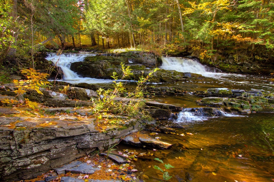 Double Waterfall with fall foliage on the Falls River in the small town of L'Anse in the Upper Peninsula of Michigan.