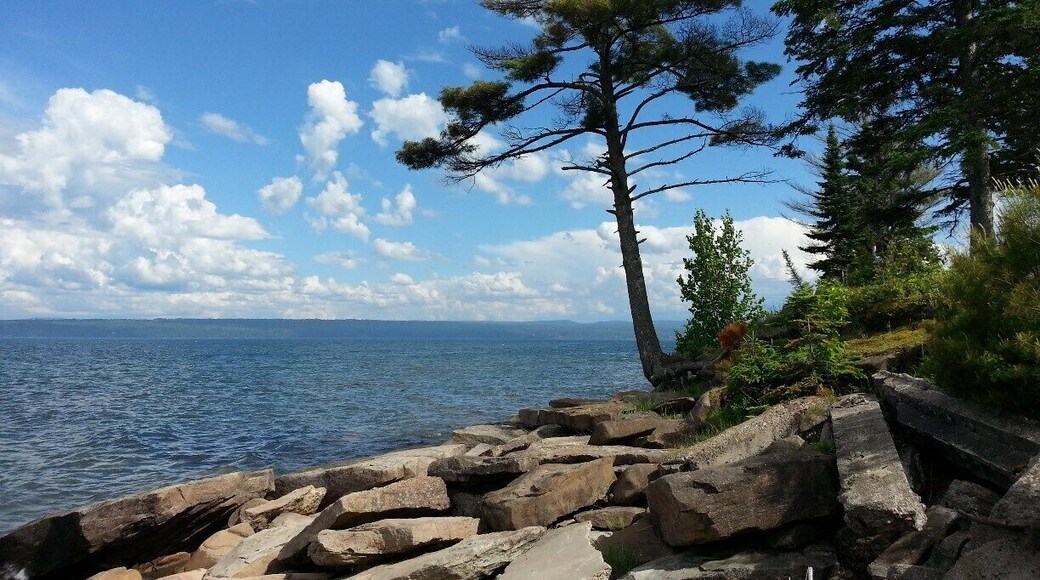 Driving along the bay at Baraga, you will find untouched natural beauty. Crisp air, bright sun, and the beautiful waters of Lake Superior. No salt! #puremichigan