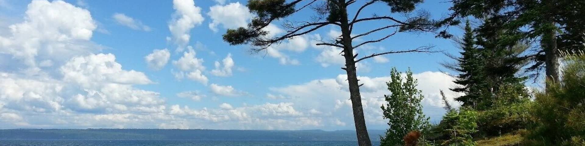 Driving along the bay at Baraga, you will find untouched natural beauty. Crisp air, bright sun, and the beautiful waters of Lake Superior. No salt! #puremichigan