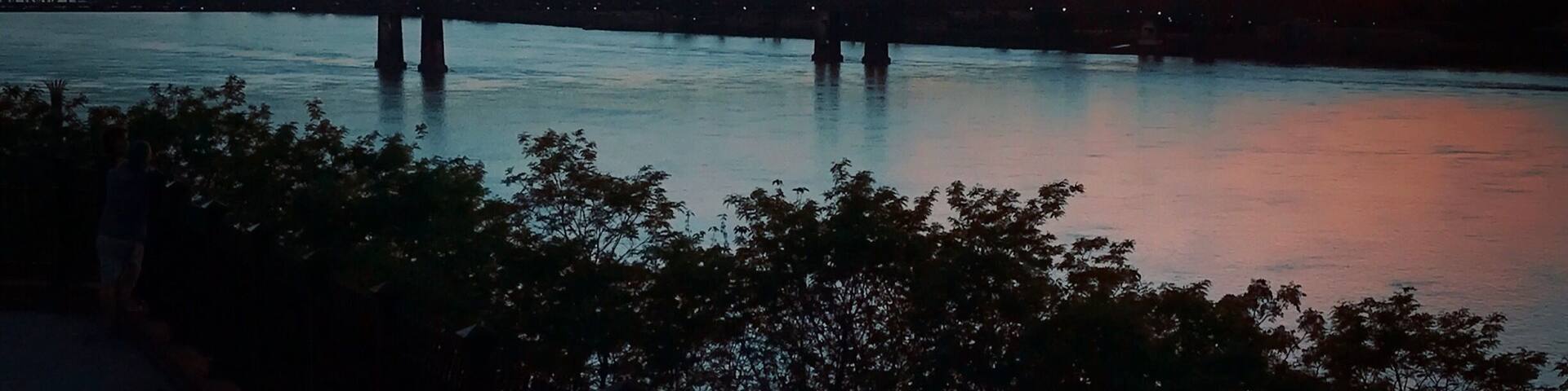 Sunset over the Mississippi River in Natchez, Mississippi. Bridge connecting Mississippi and Louisiana.
