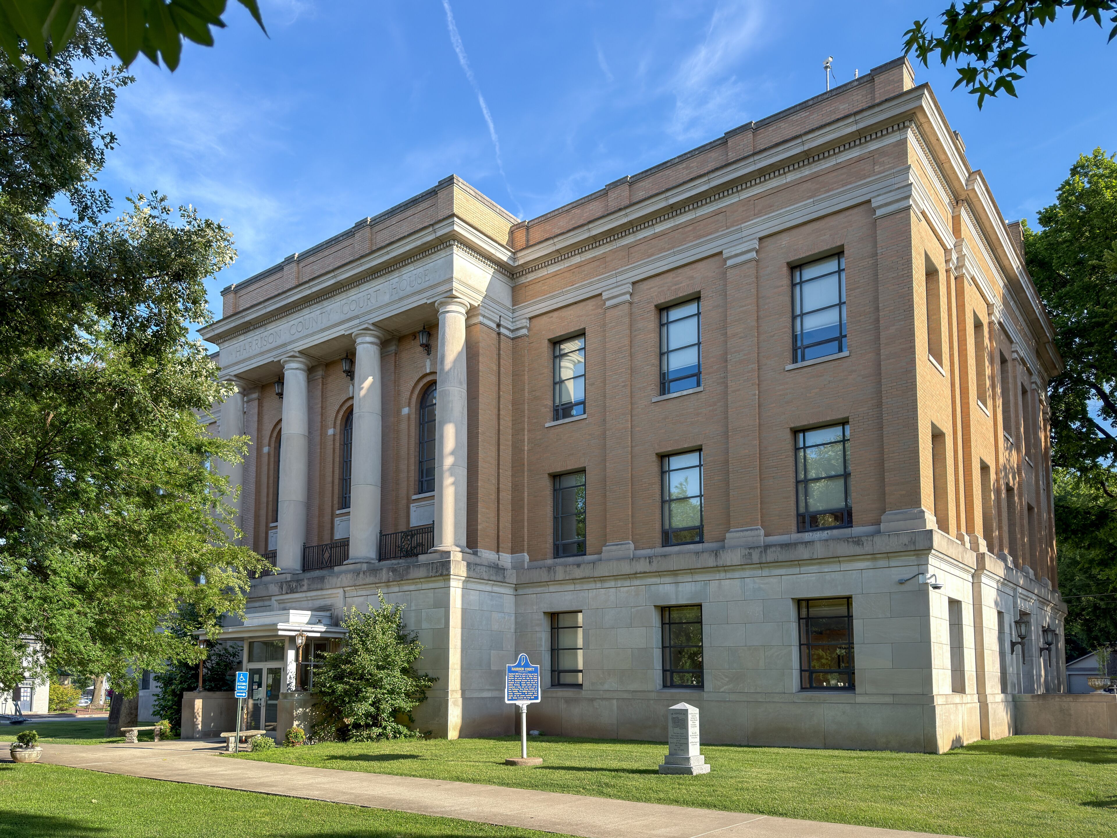 A courthouse with classical architecture, featuring columns and a prominent entrance.