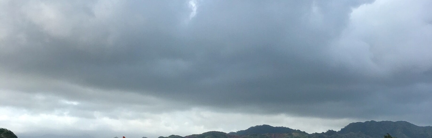 Walking along the Maha'ulepu Heritage Trail on Kauai, Hawaii. Park at Shipwrecks Beach and head east.