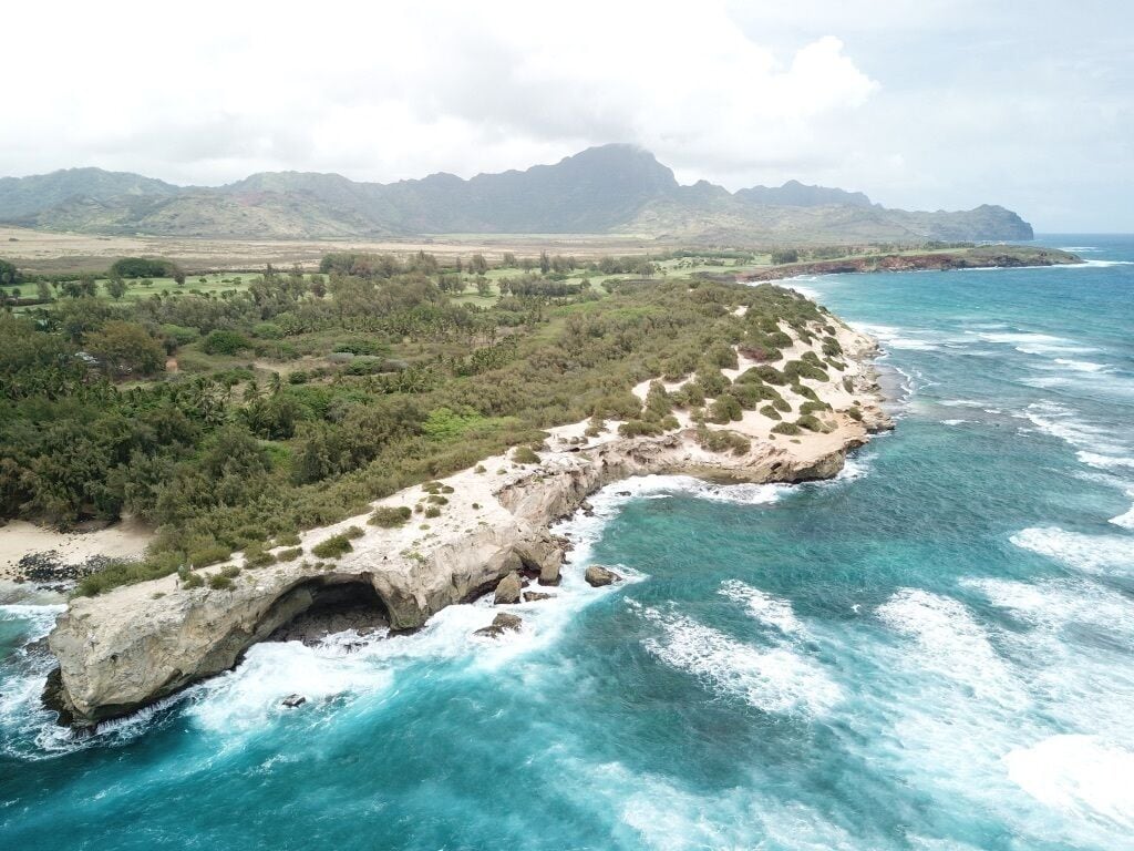 At the start of the Mahaulepu Heritage Trail, Shipwreck Beach in Kauai, HI boasts fantastic views of the beach and mountains alike. Grab a towel and watch the locals catch a waive, then walk a few miles down a desolate trail to find hidden caves and beautiful wildlife. After the hike, the Grand Hyatt hotel is just a few steps away with a public bar and restaurant. #LifeAtExpedia