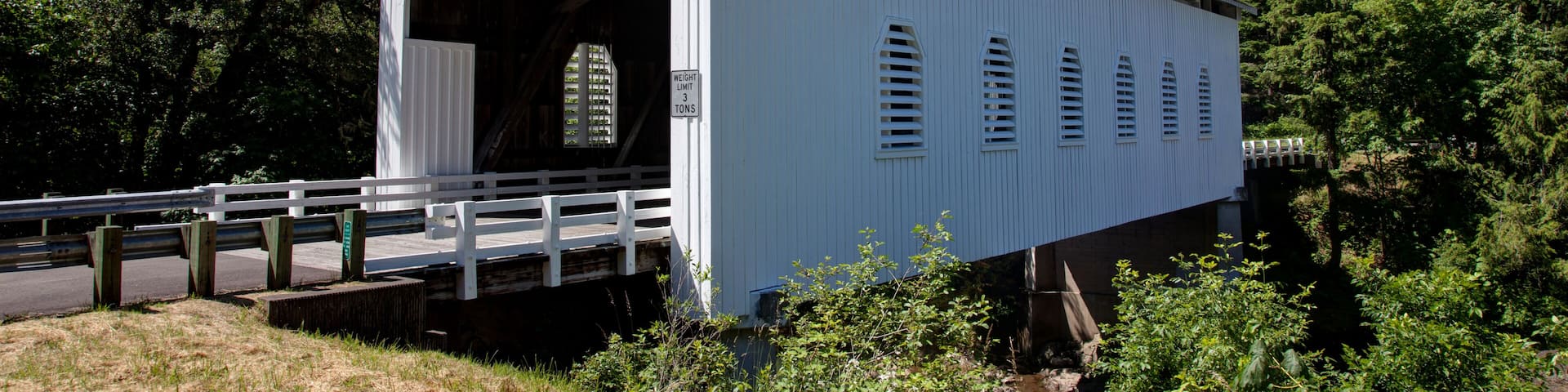 A wooden covered bridge around the Cottage Grove Area of Oregon USA America; Shutterstock ID 107914484