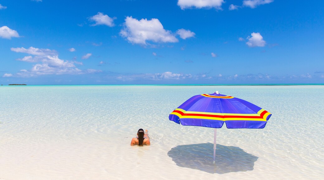 Woman On Beach with Umbrella in Bahamas