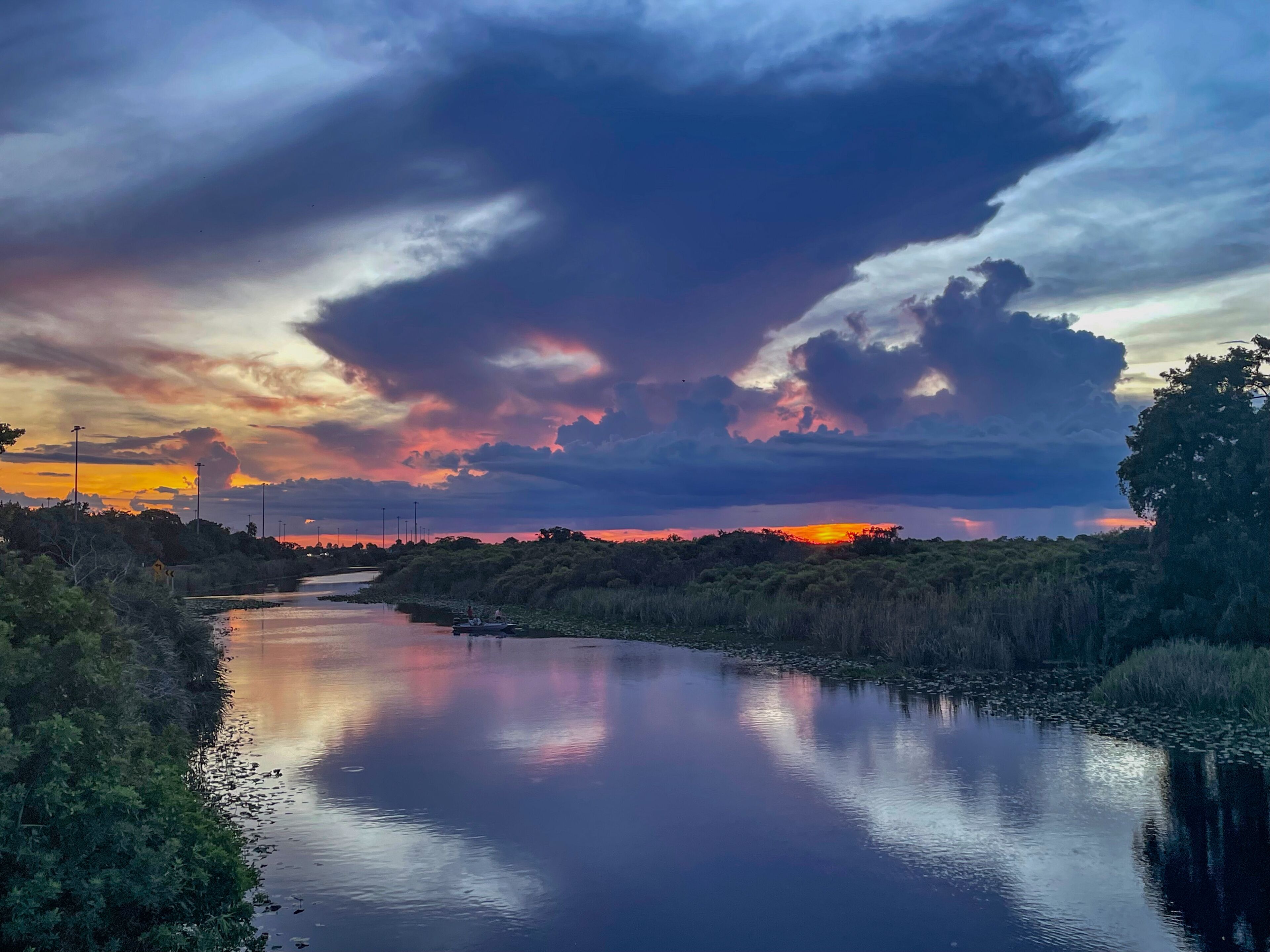 Swamp sunset and hurricane clouds