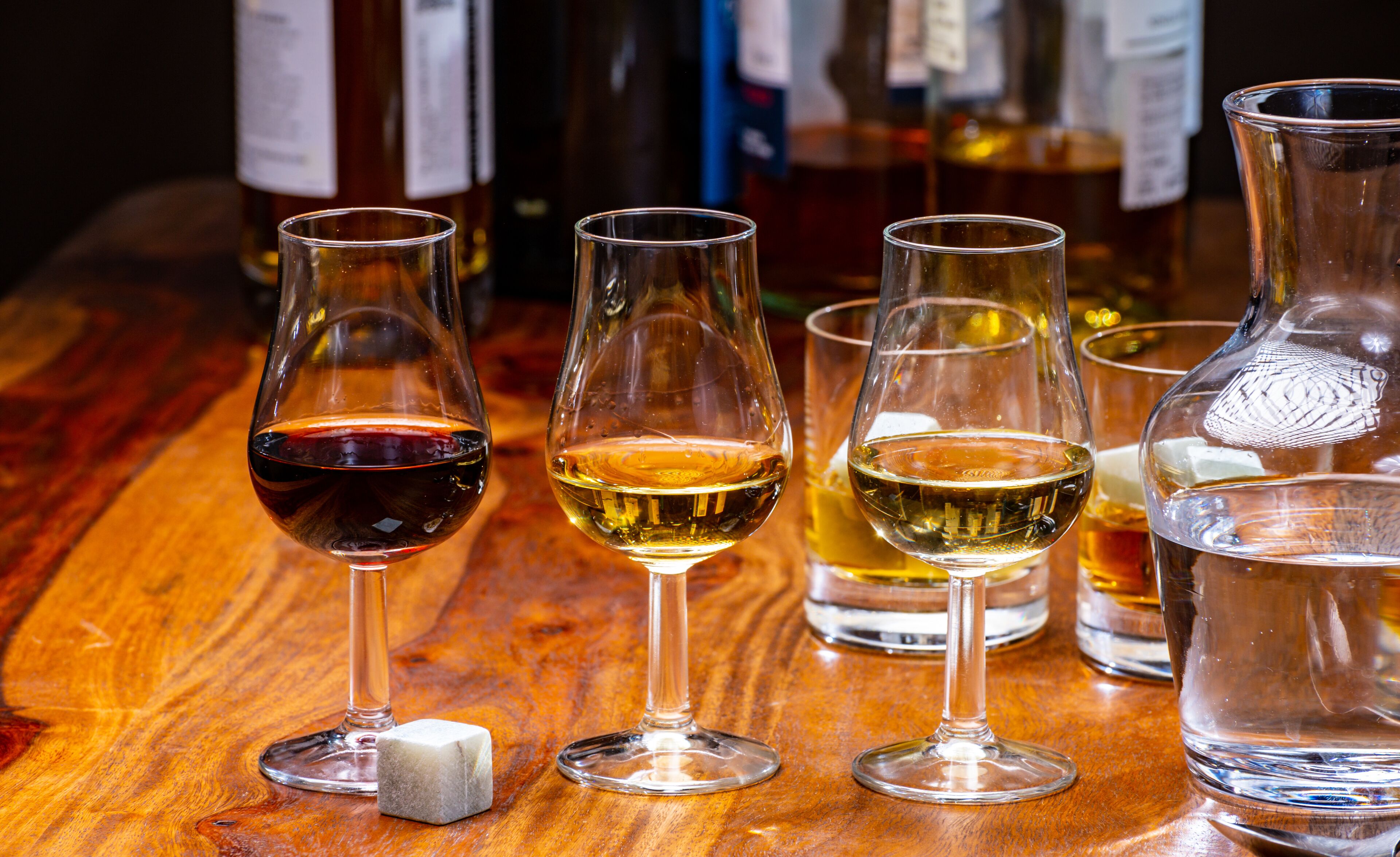 Tasting glass with strong alcoholic spirit drink whisky, cognac, armagnac or calvados