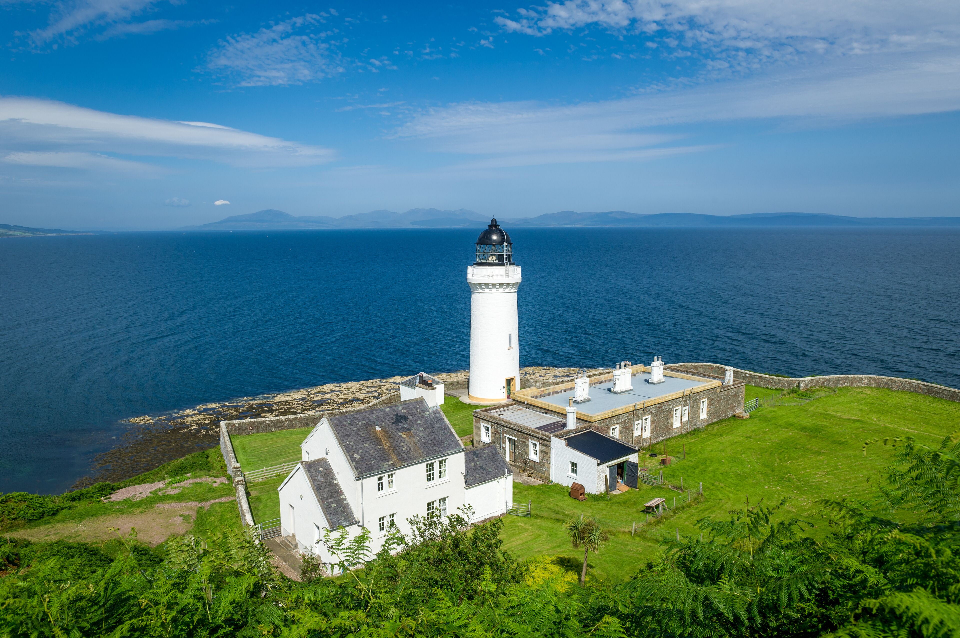 Davaar island lighthouse and cottages view from the hill. Campbeltown, Scotland