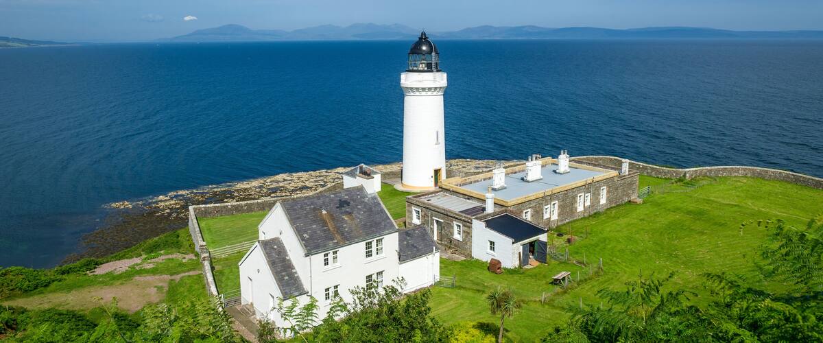Davaar island lighthouse and cottages view from the hill. Campbeltown, Scotland