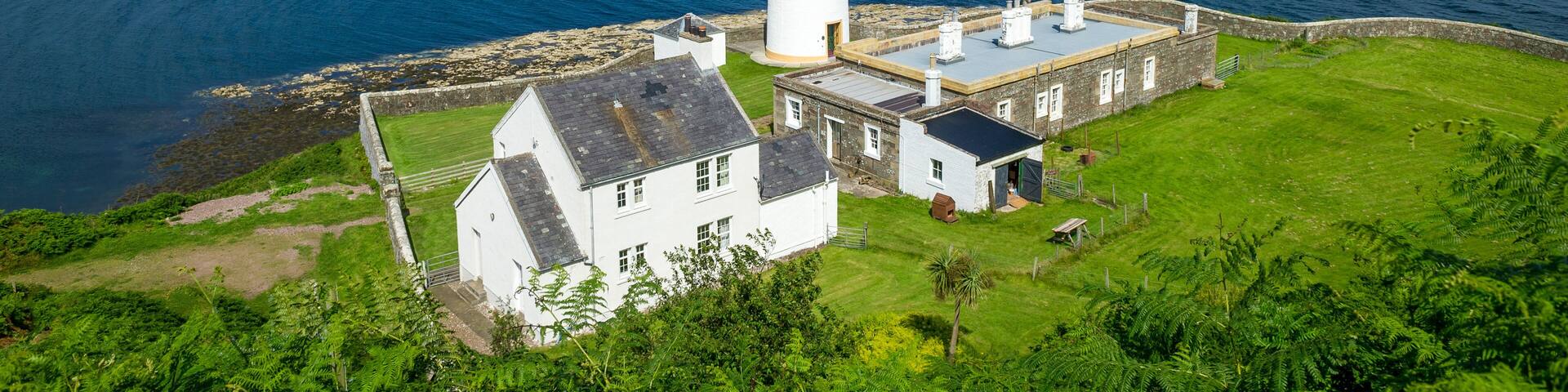 Davaar island lighthouse and cottages view from the hill. Campbeltown, Scotland