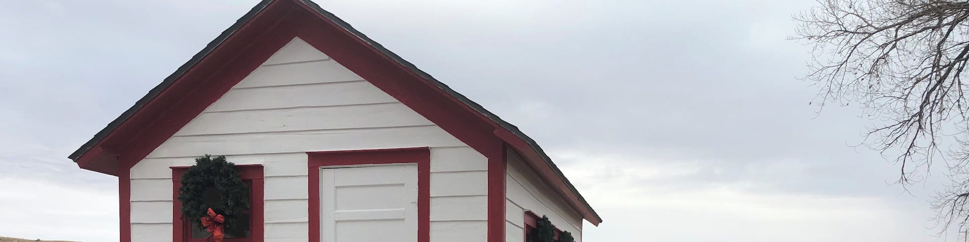 Tiny one room rural school that has been total restored to the original by historian neighbor lady. This school was built on skids and was pulled by team of horses to were ever the most children was in the district.