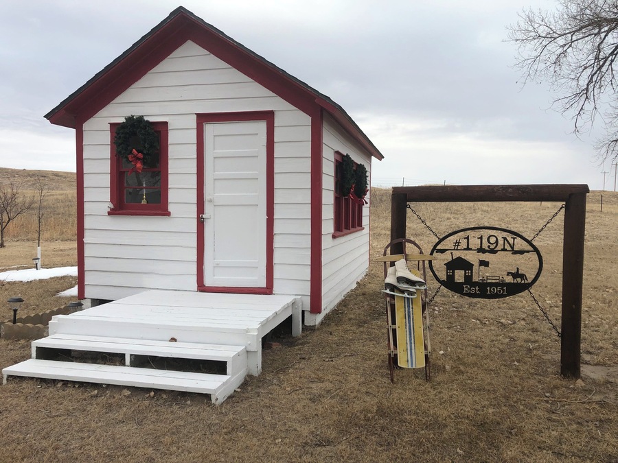 Tiny one room rural school that has been total restored to the original by historian neighbor lady. This school was built on skids and was pulled by team of horses to were ever the most children was in the district.