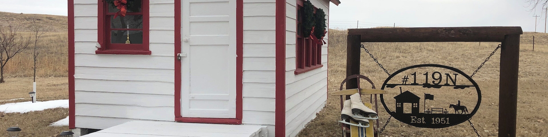 Tiny one room rural school that has been total restored to the original by historian neighbor lady. This school was built on skids and was pulled by team of horses to were ever the most children was in the district.