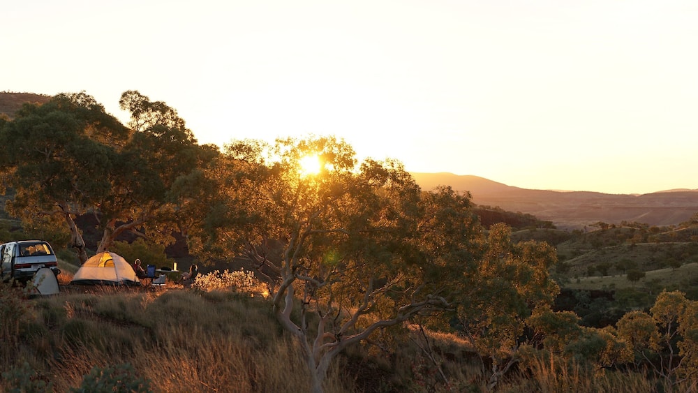 Hiking and camping in the hilly landscapes near Dales Gorge and Karijini National Park in Western Australia.