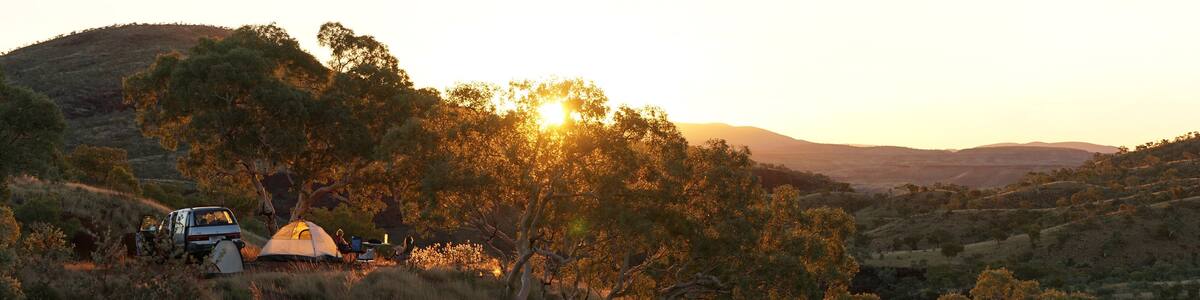 Hiking and camping in the hilly landscapes near Dales Gorge and Karijini National Park in Western Australia.