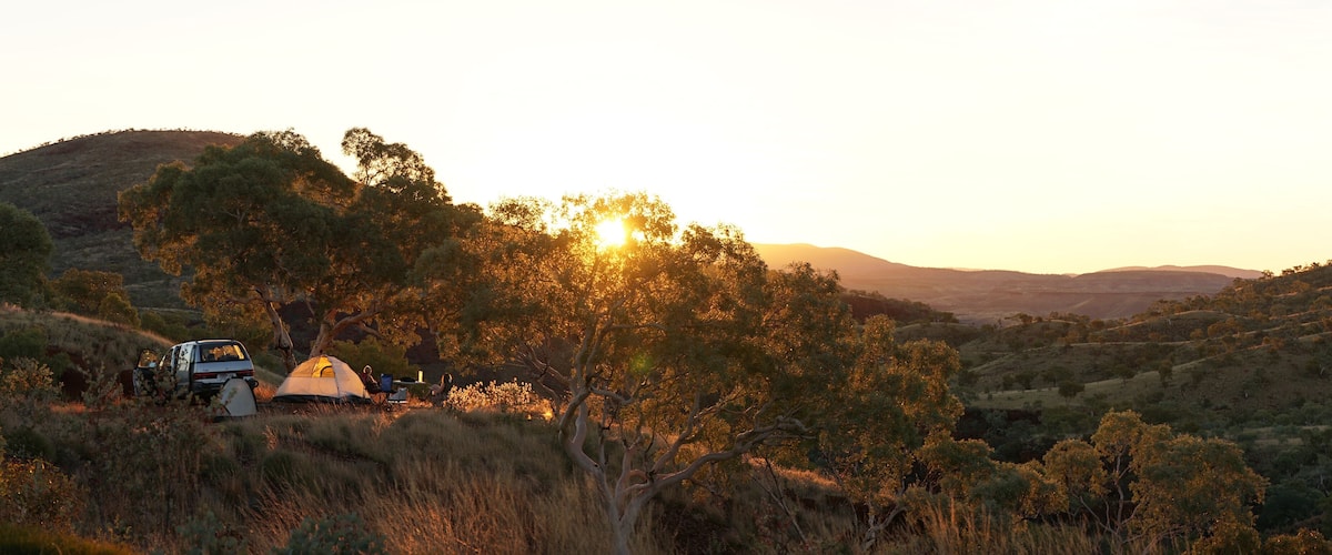 Hiking and camping in the hilly landscapes near Dales Gorge and Karijini National Park in Western Australia.