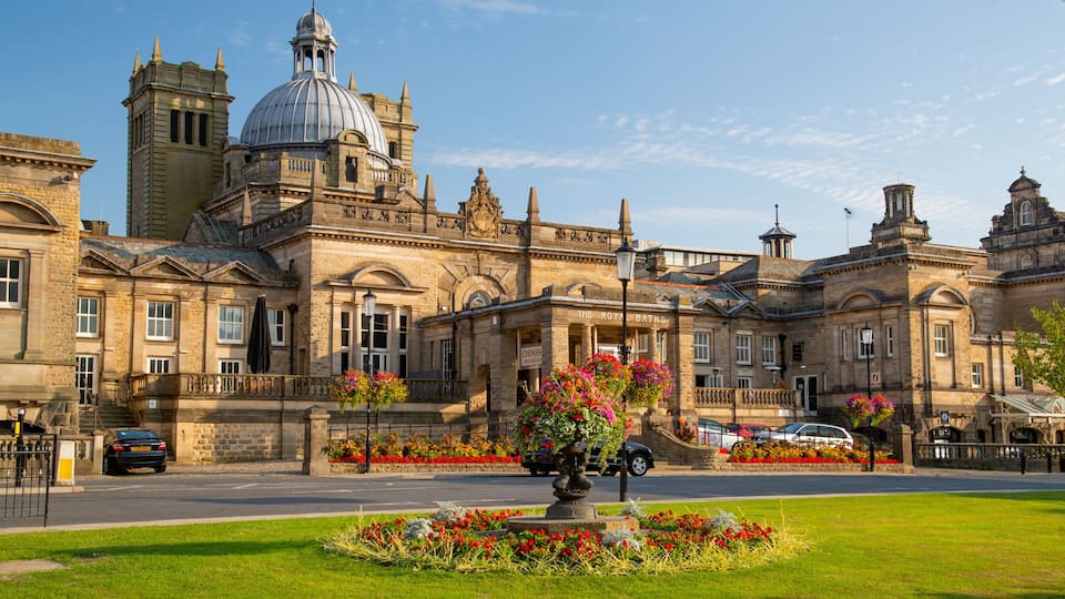 A historic building with a large dome and clock tower.