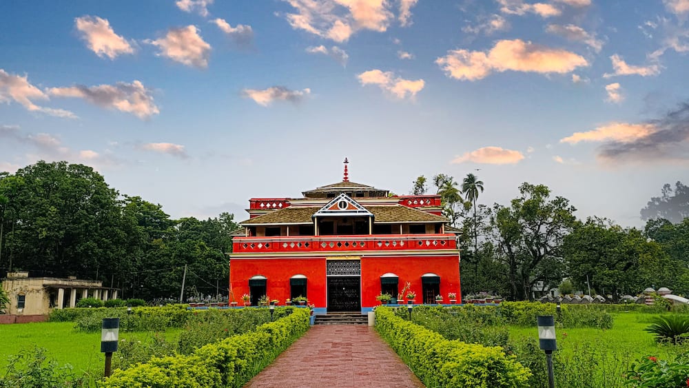 This is a vibrant photograph of Rabindranath Tagore's Kuthibari located in Shilaidaha, Kushtia, Bangladesh.