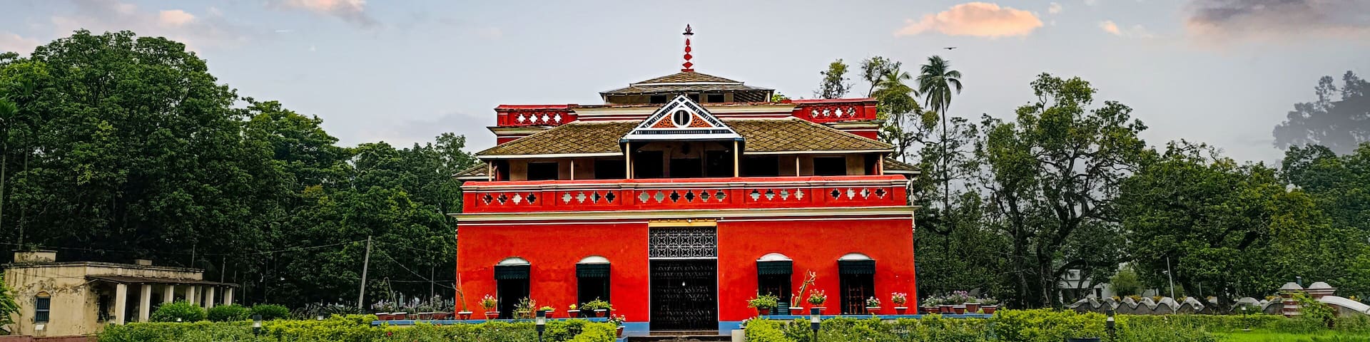This is a vibrant photograph of Rabindranath Tagore's Kuthibari located in Shilaidaha, Kushtia, Bangladesh.