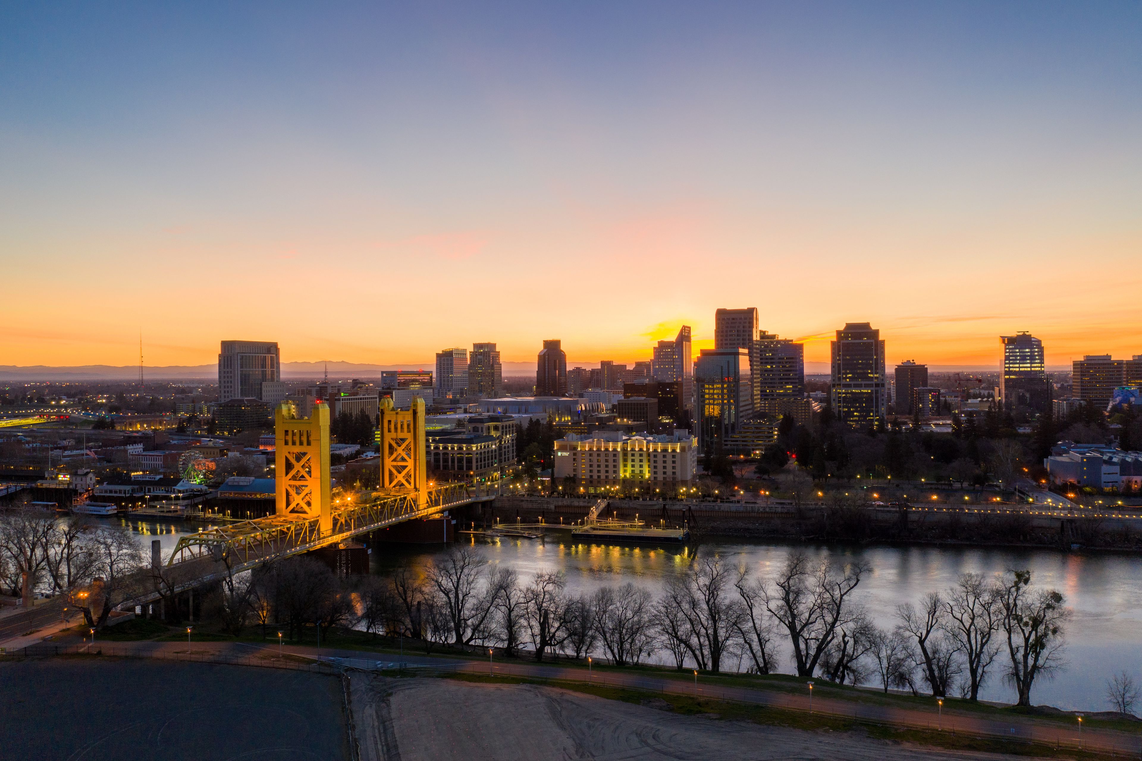 Aerial views of downtown Sacramento skyline and bridges.