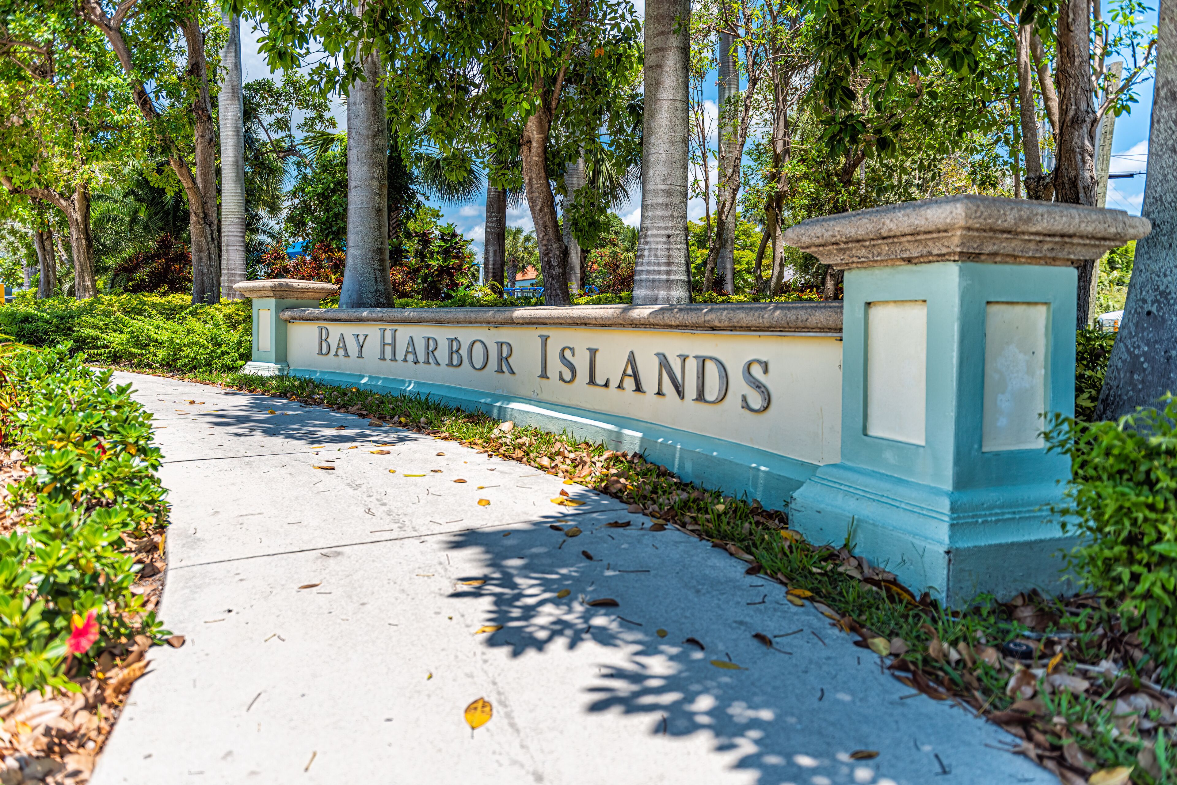A pathway leading to a sign that reads 'Bay Harbor Islands.'