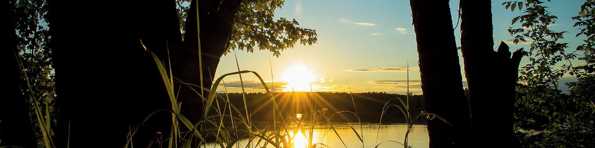 This boat launch in Passadumkeag, Maine sits right in the corner of the Penobscot River and the Passadumkeag River. It's one of my favorite places to sit in the evening and watch the sunset. Because Passadumkeag is extremely rural, this boat access is usually pretty solitary, but it's a great entry point into the calm waters of the Penobscot for kayakers and boaters.
The boat access is easy to find. It's located on Route 2, a simple drive through simple terrain with relatively little traffic. Travelers to Maine can follow my map pin right to the parking lot. It comfortably fits about four vehicles with trailers, but you'll rarely find more than one here at a time. Highly recommended for people who like to get out on the water and relax.
#sunsets #maine #rivers