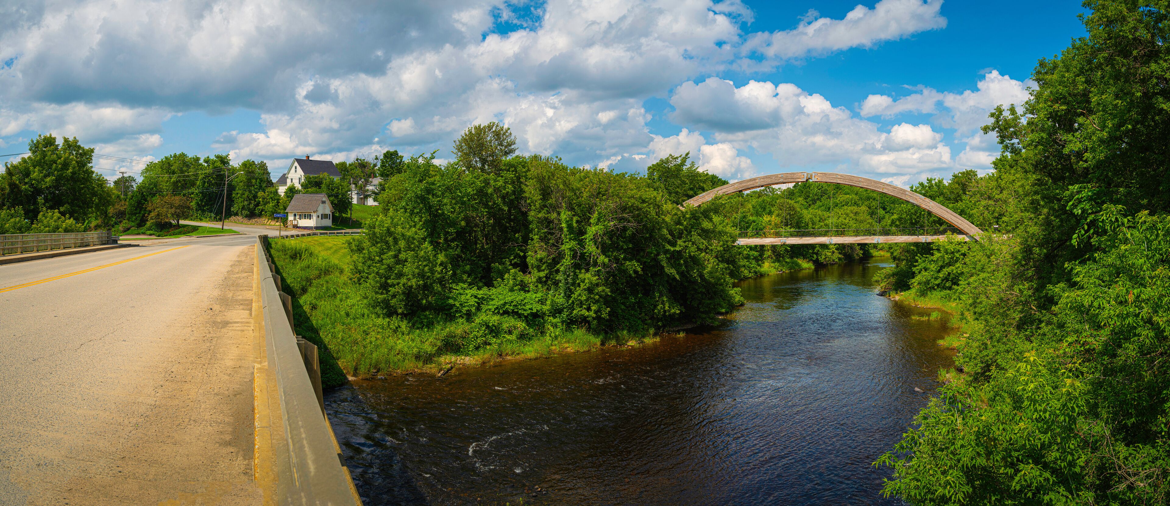 Gateway Crossing Bridge and Highway Route 1 over Houlton Riverfront Park in Northern Maine on a summer day