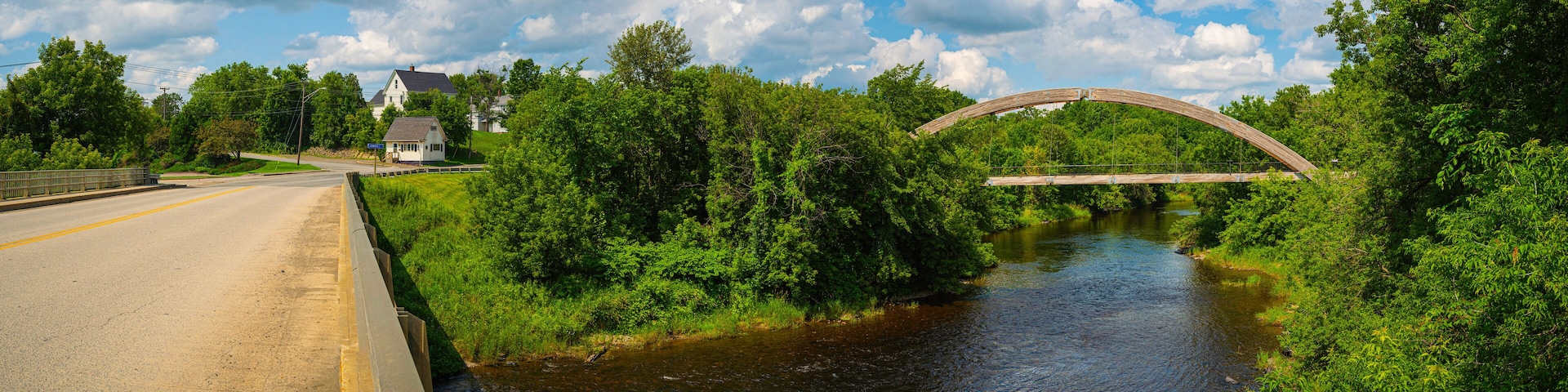 Gateway Crossing Bridge and Highway Route 1 over Houlton Riverfront Park in Northern Maine on a summer day