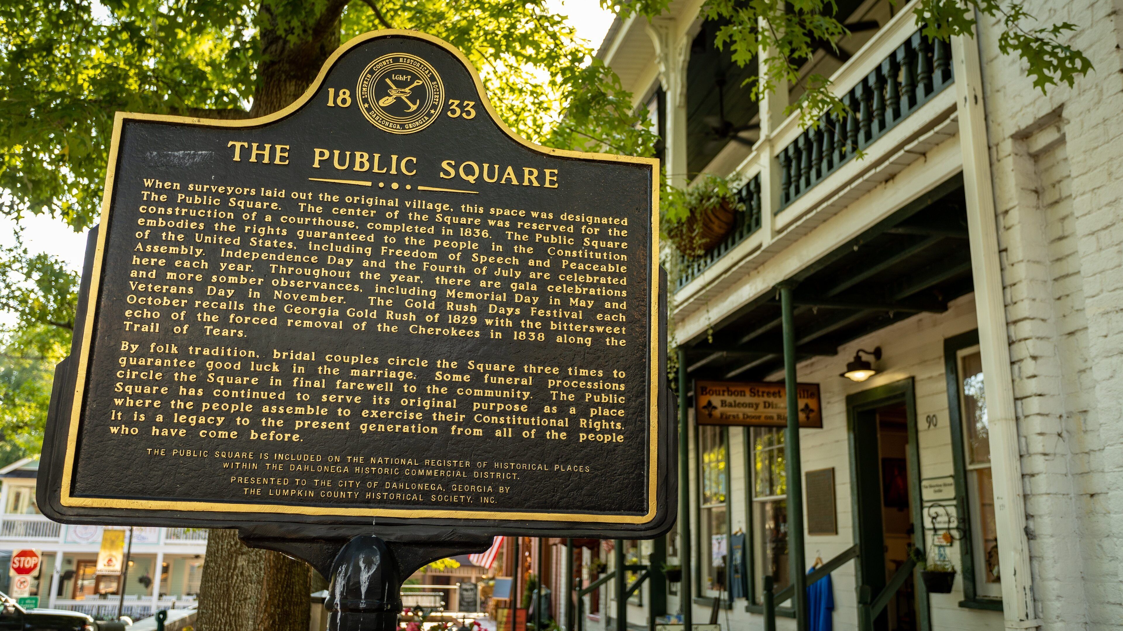 A historical marker sign for The Public Square.