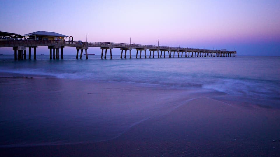 A pier extending into the water with a building at the end.