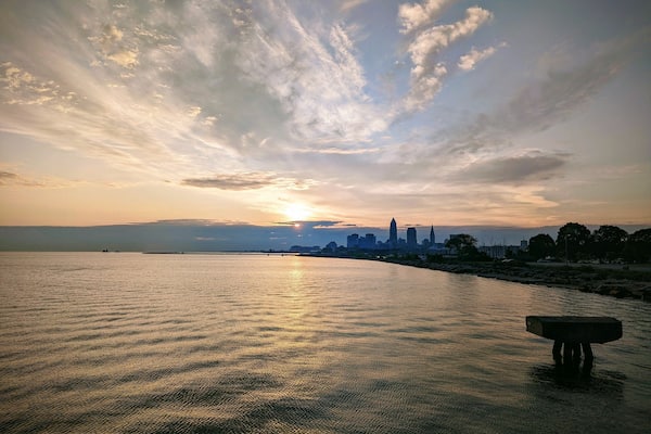 Sunset over Cleveland skyline with Lake Erie.