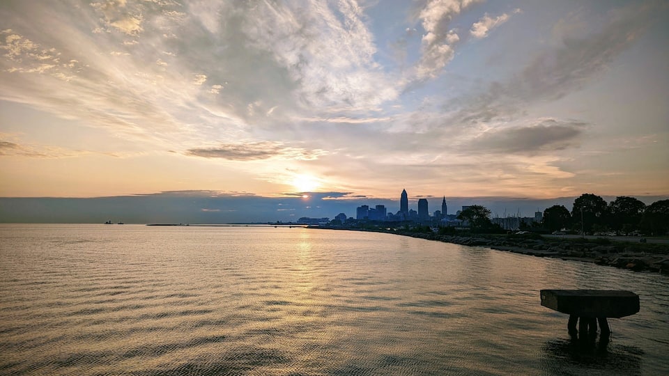 Sunset over Cleveland skyline with Lake Erie.