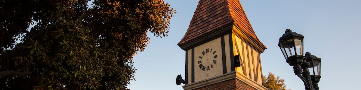 Sunset view of the public clock tower in the Civic Center of Westminster, California, USA.