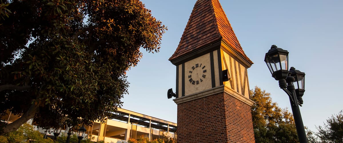 Sunset view of the public clock tower in the Civic Center of Westminster, California, USA.
