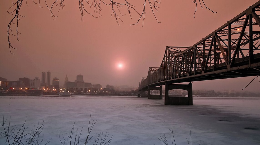 Rising Sun in Winter *A Popular Landmark*
#Murray Baker Bridge
#Peoria
#Chicago
#Illinois
#USA
#Sunrise
#Landscape
This location is the highest crime area in Peoria, actually I put myself in high risk while capturing this photo. That day I arrived this place at 5am in early morning purposely waited for sunrise, the temperature was so cold and below zero. A patrol car suddenly stopped me, the police officer asked me to leave this place immediately. I told the police officer "Please allow me to take at least one sunrise photo, I spent 3 hours drove from my home to here". Ended up the police officer accompany me for protection till I done, really thanks to the police officer :) Rising sun at dawn in winter, photo captured in a freezing cold morning under Murray Baker Bridge, Peoria Illinois USA.
Photo Licensed by iLOVEnature's Photography Inspiration l All rights reserved