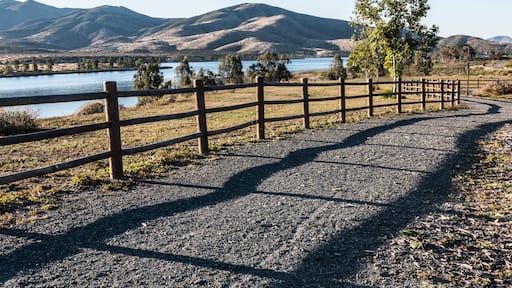 Pathway, trees, lake and mountains at Mountain Hawk Park in Chula Vista, California. ; Shutterstock ID 408255850