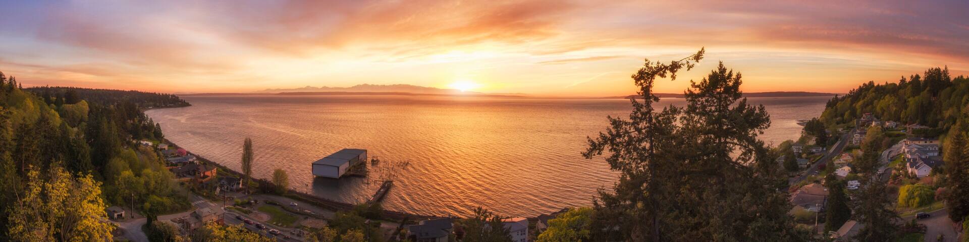 Panoramic view of sunset over lake in remote landscape