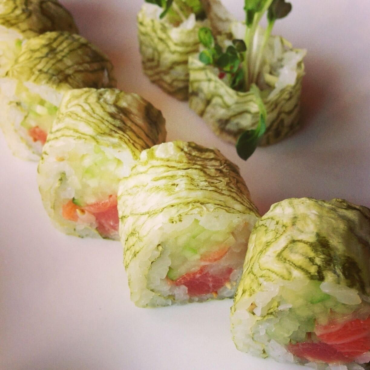 In the middle of the dense 50th and France neighborhood is the fresh and consistently good Japanese cuisine at Raku. This is the tuna, salmon, yellowtail roll called Three Of A Kind. Highly recommended. 