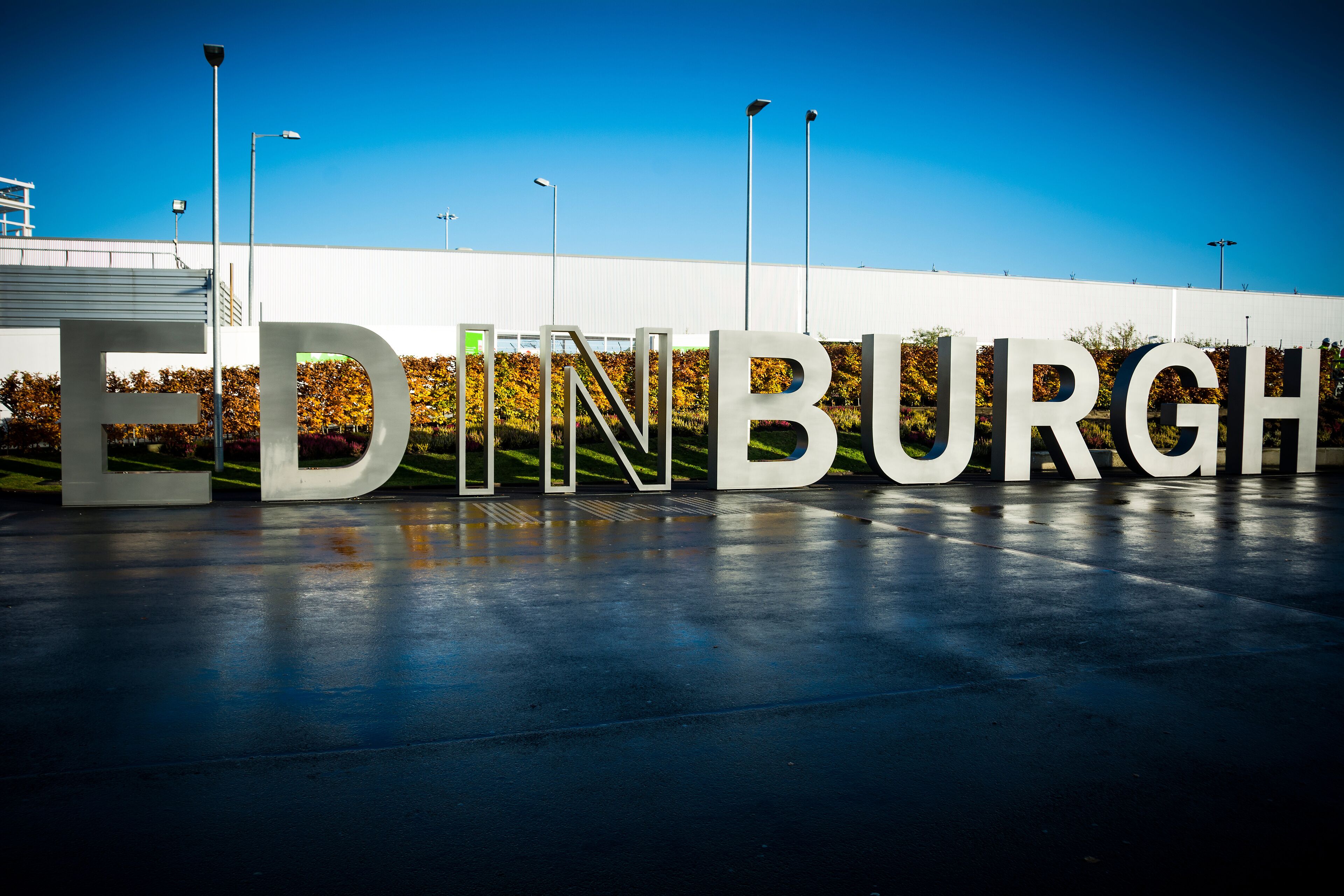 Large white letters spelling "EDINBURGH" on a building facade.